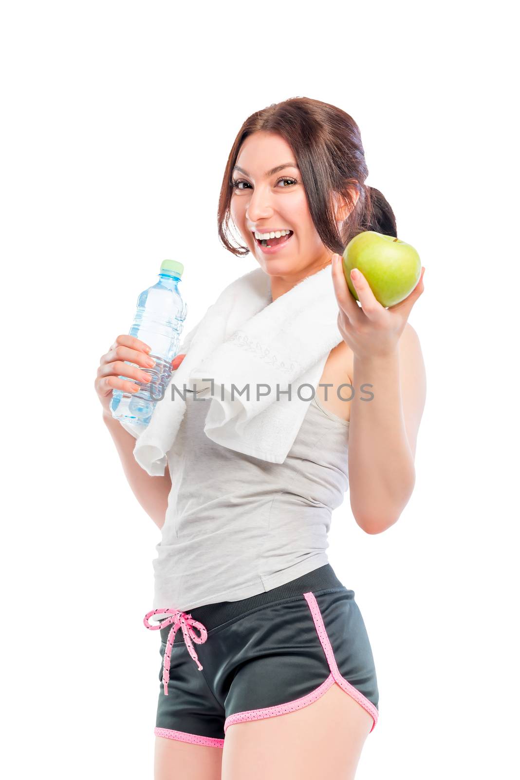 young woman with a beautiful smile holding an apple