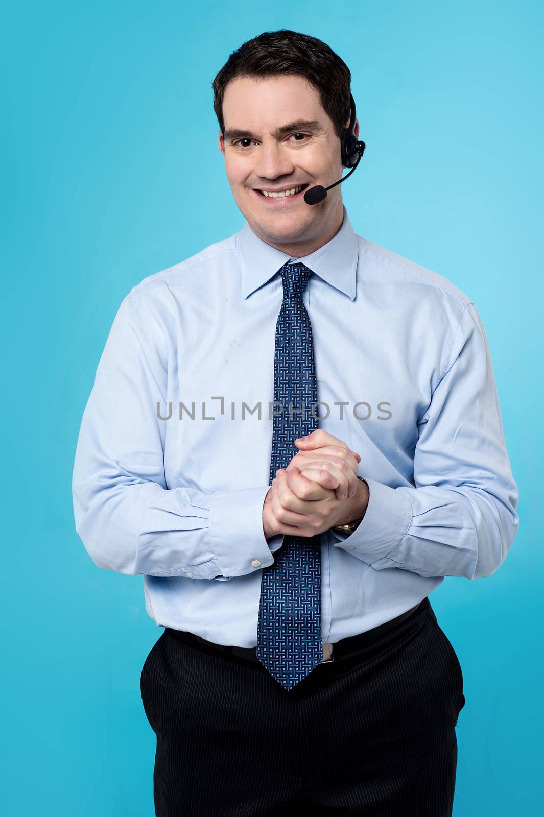 Customer support executive male with clasped hands