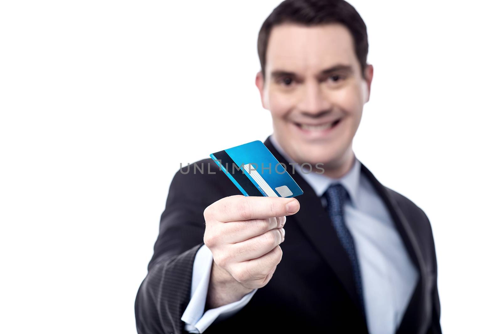 Smiling businessman offering his credit card over white