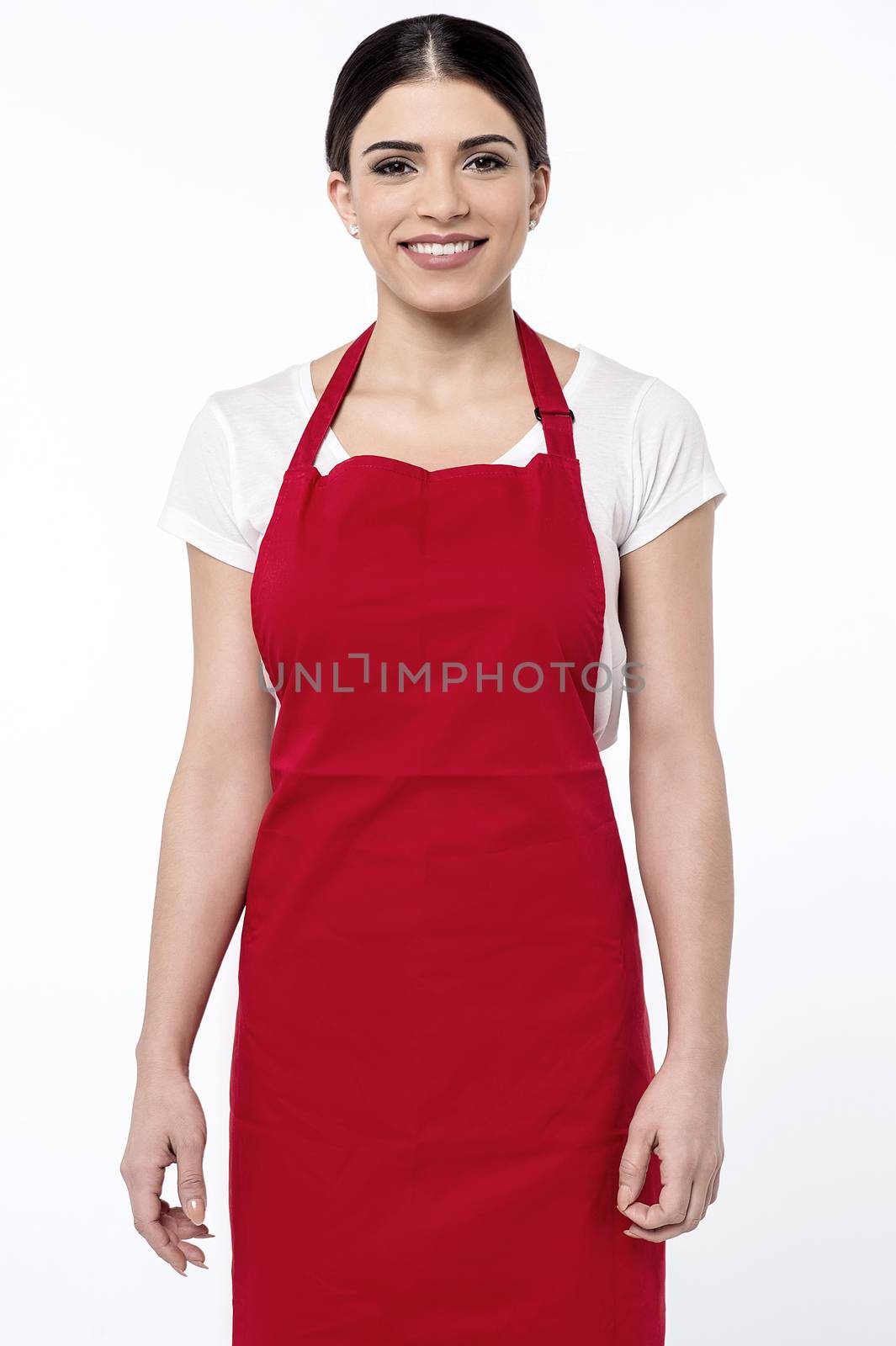 Image of a young female chef posing over white