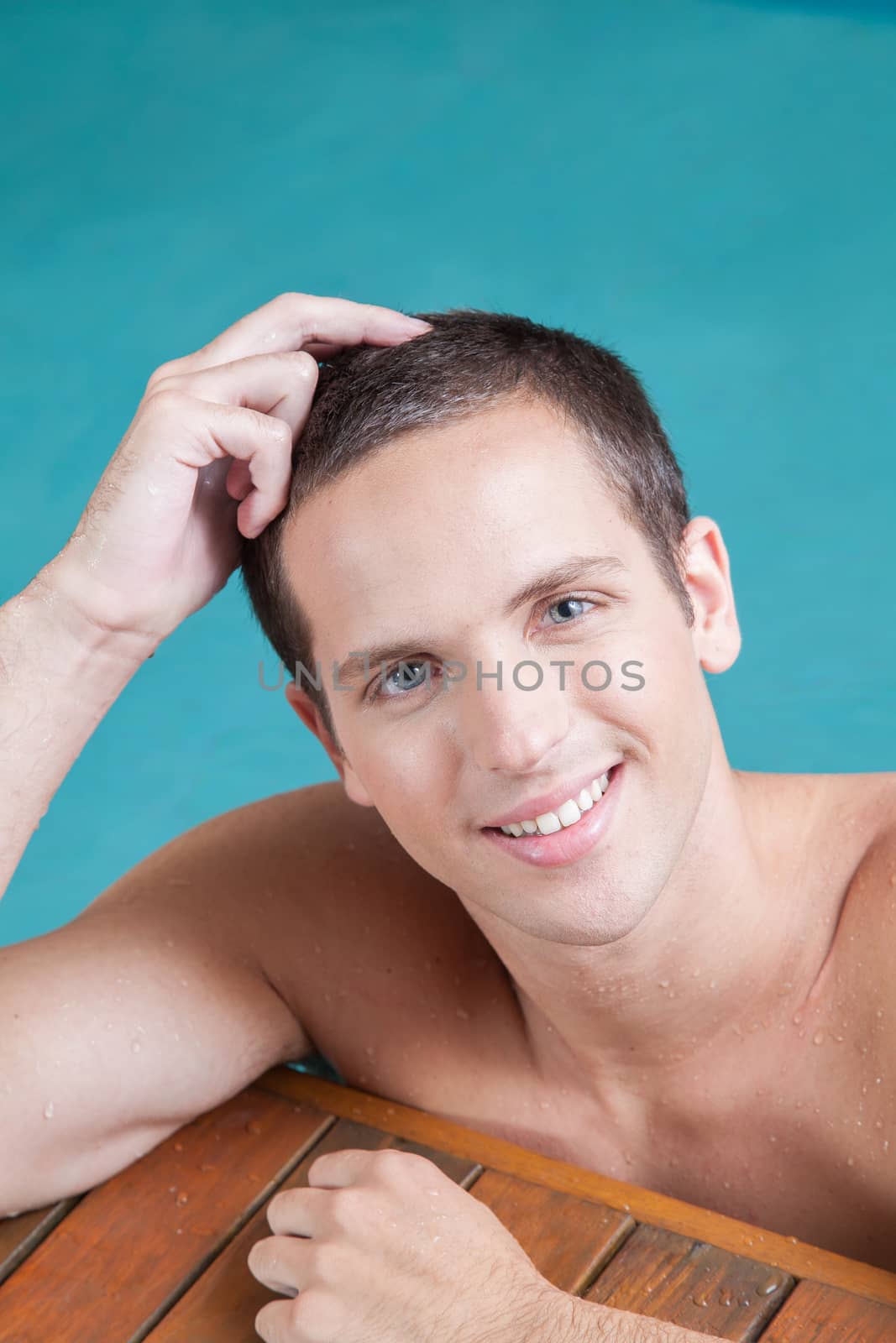 Man resting inside the pool by ifilms