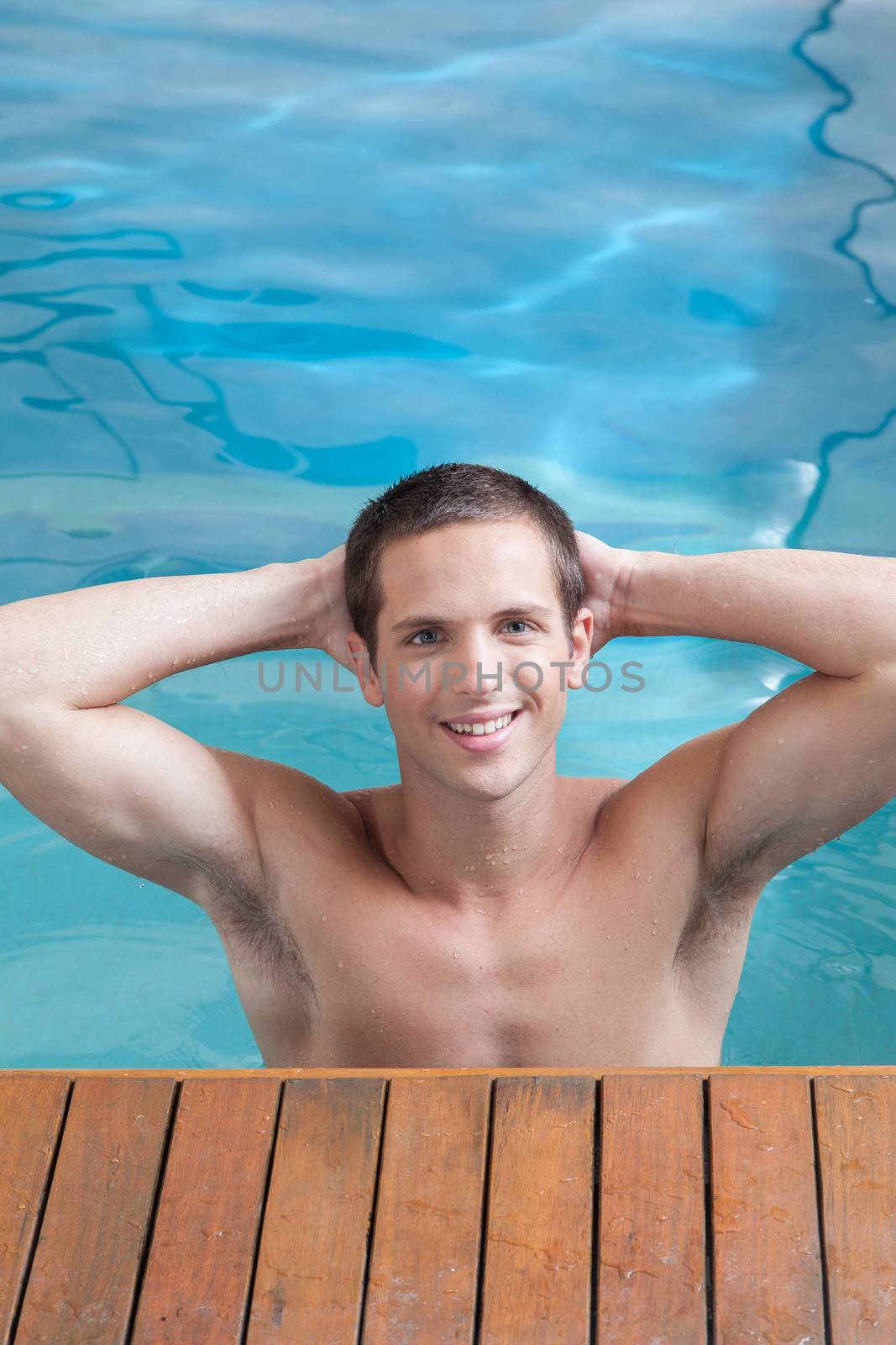 Man exercising in a pool