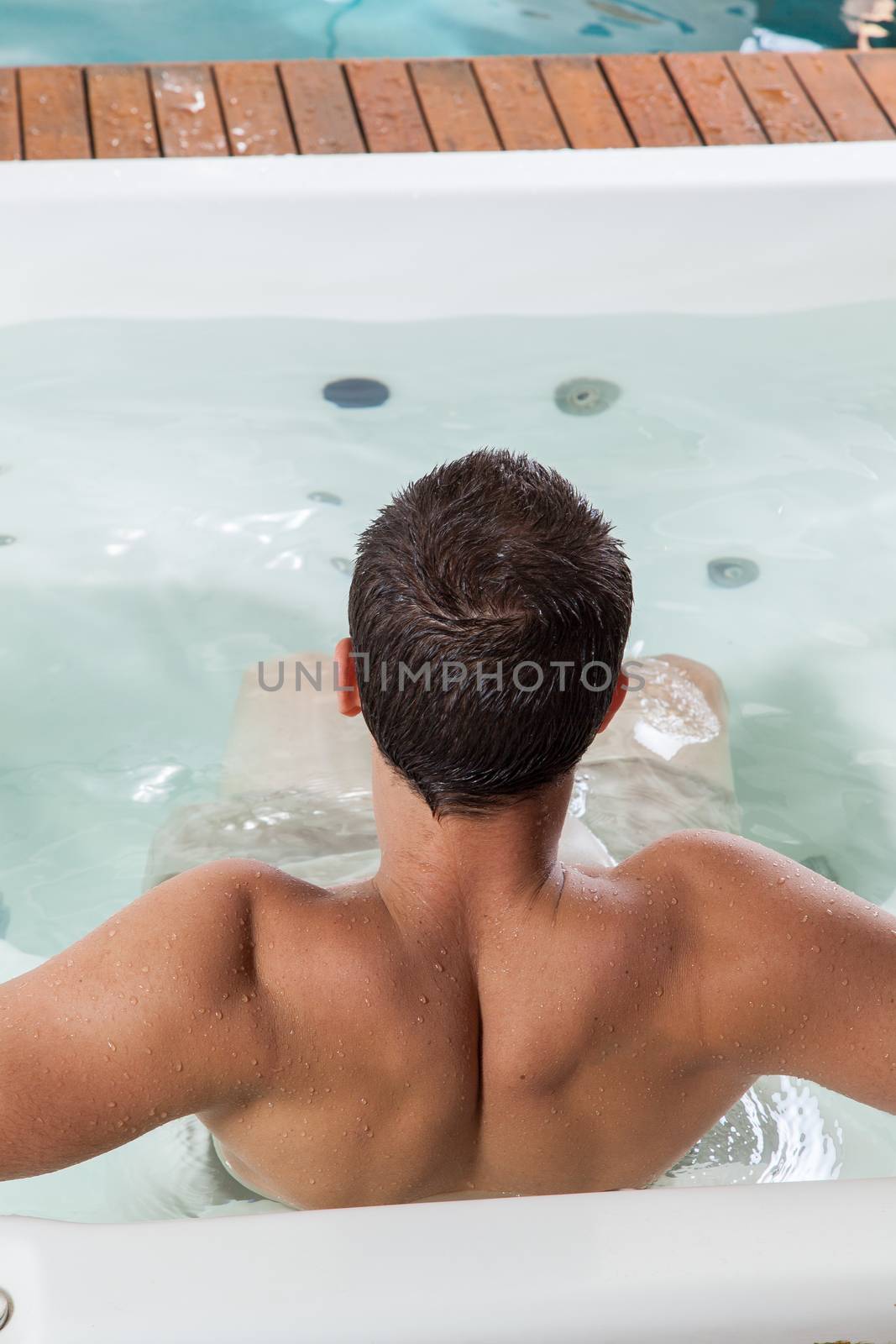 Man back inside a jacuzzi