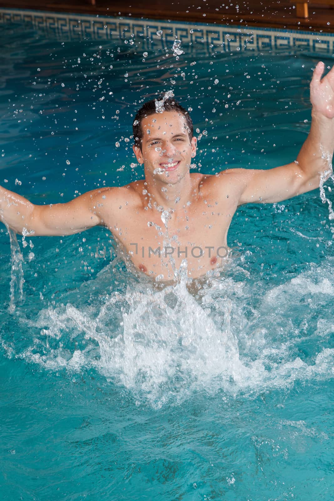 Funny man playing in the pool
