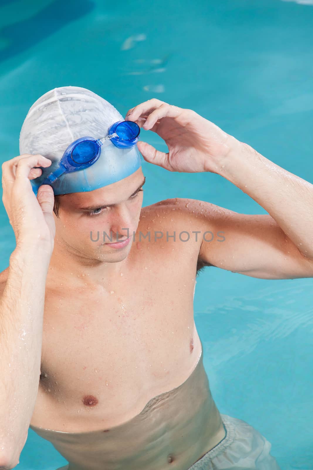 Guy putting on goggles