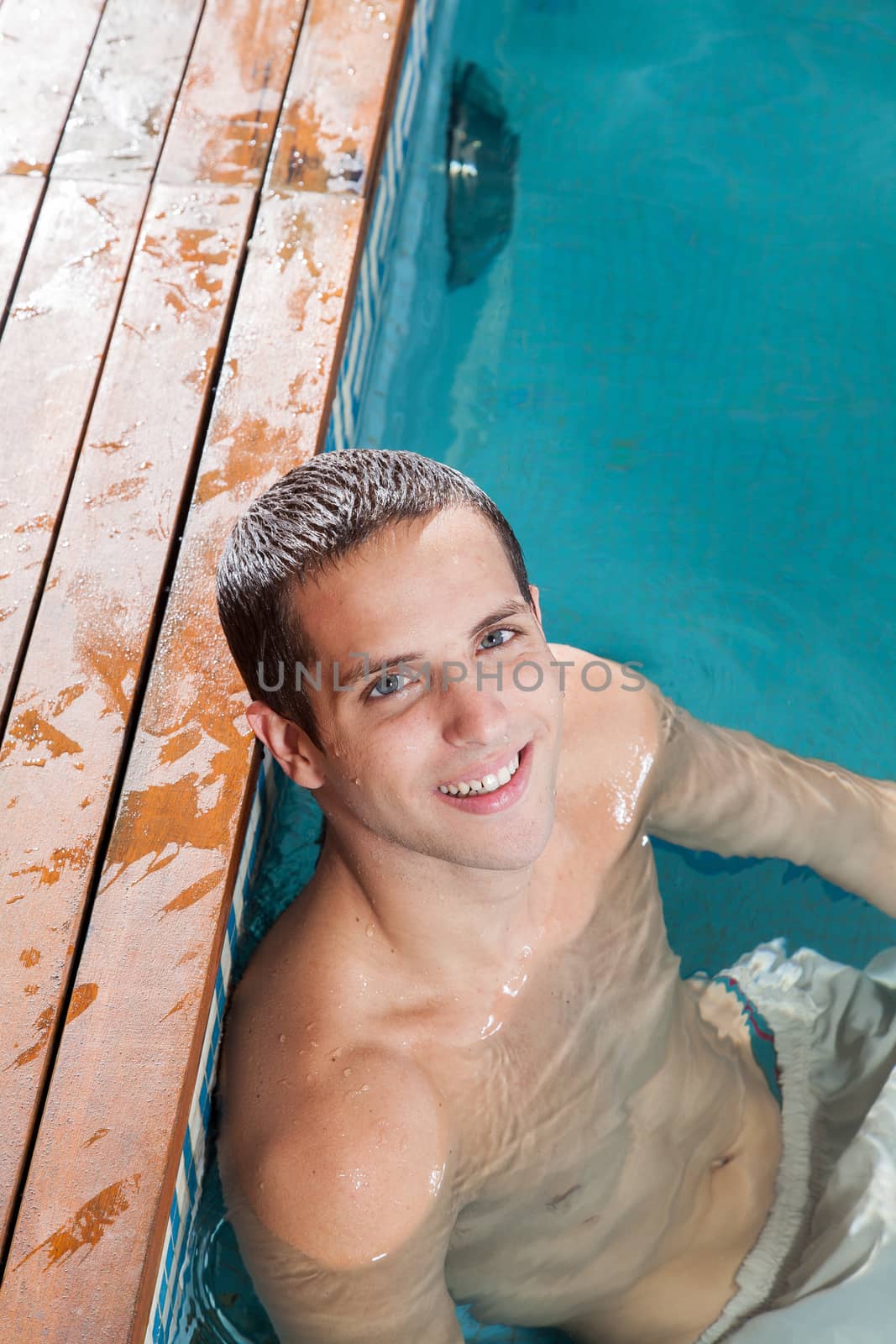Guy resting in the pool