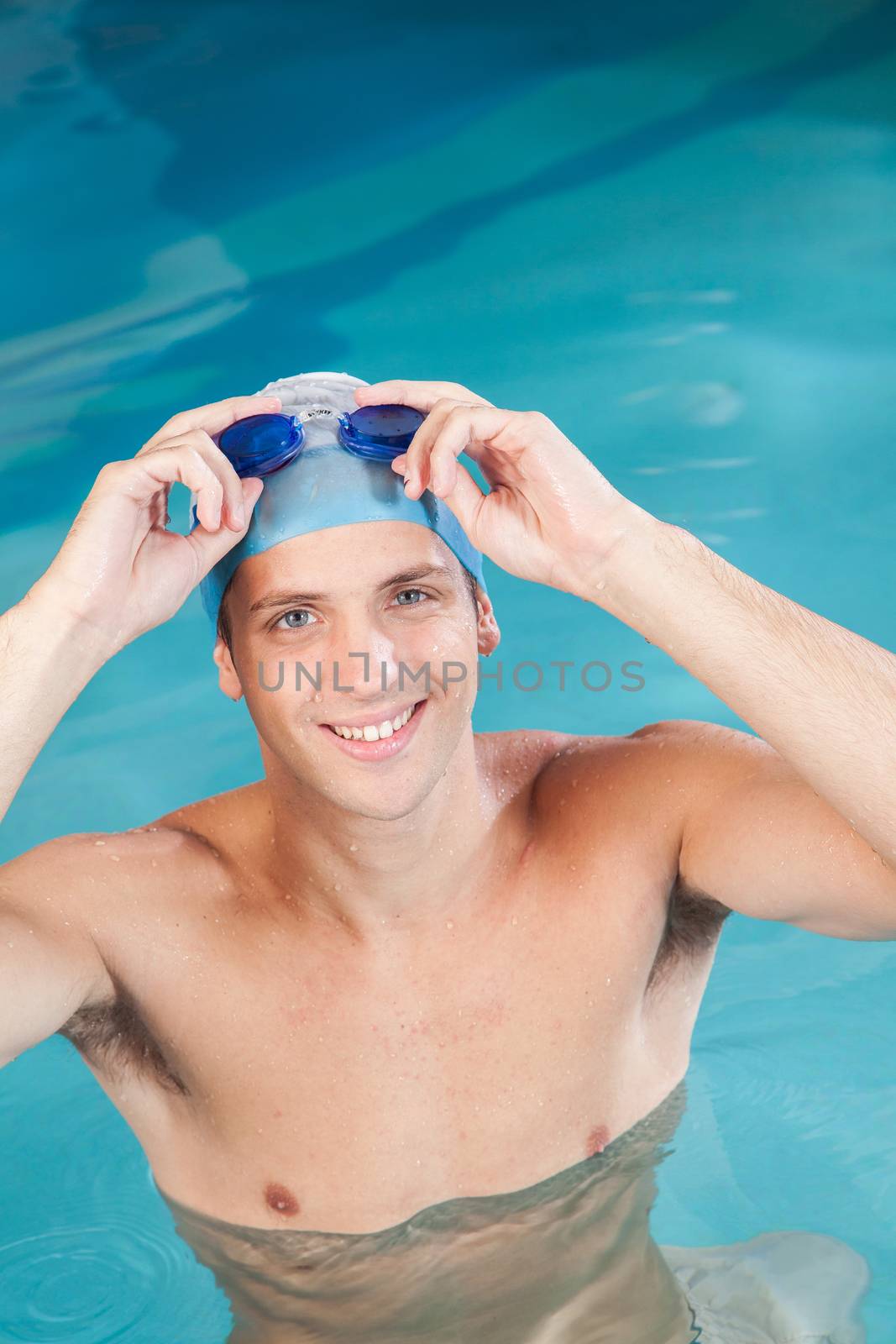 Man putting on goggles