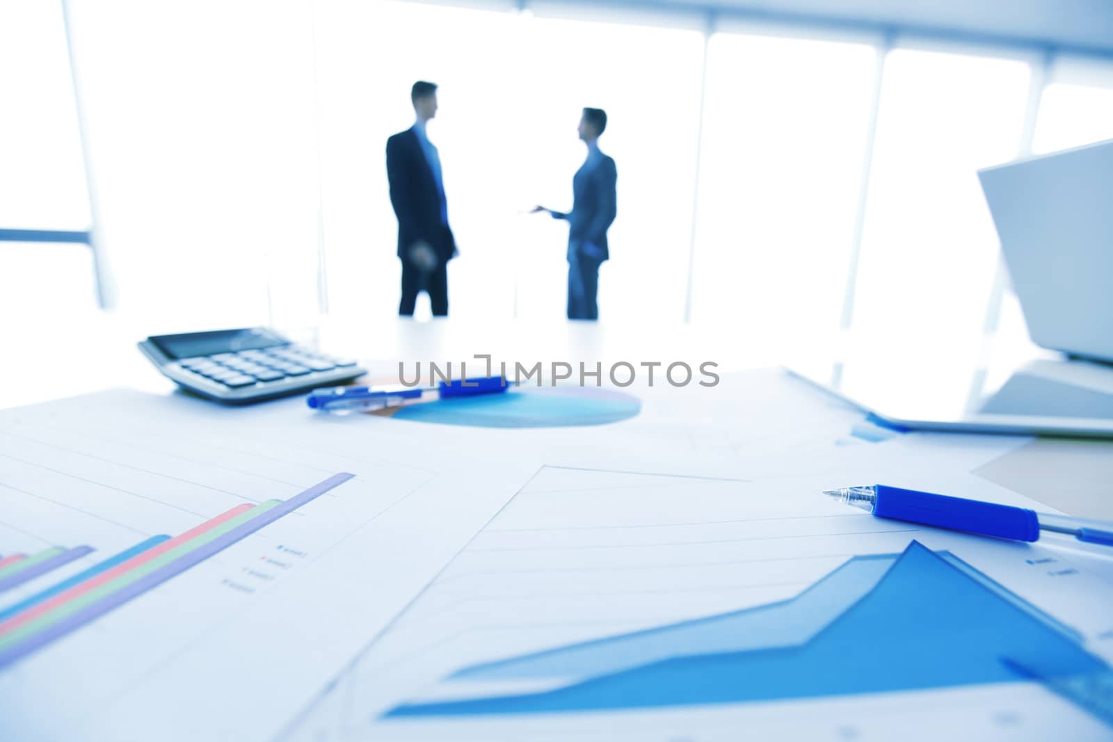 Businessmen and documents by ALotOfPeople