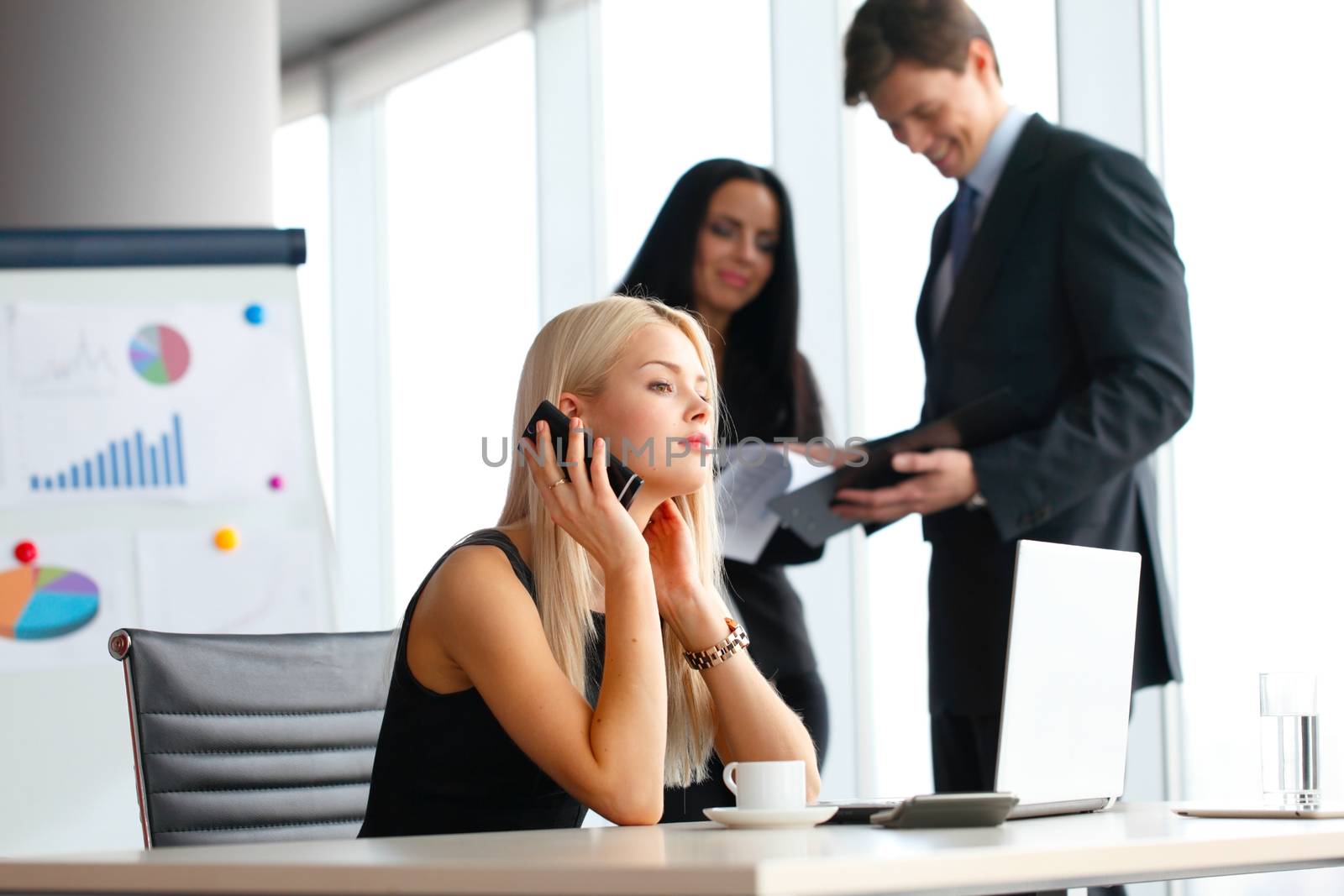 Businesswoman talking on phone by ALotOfPeople