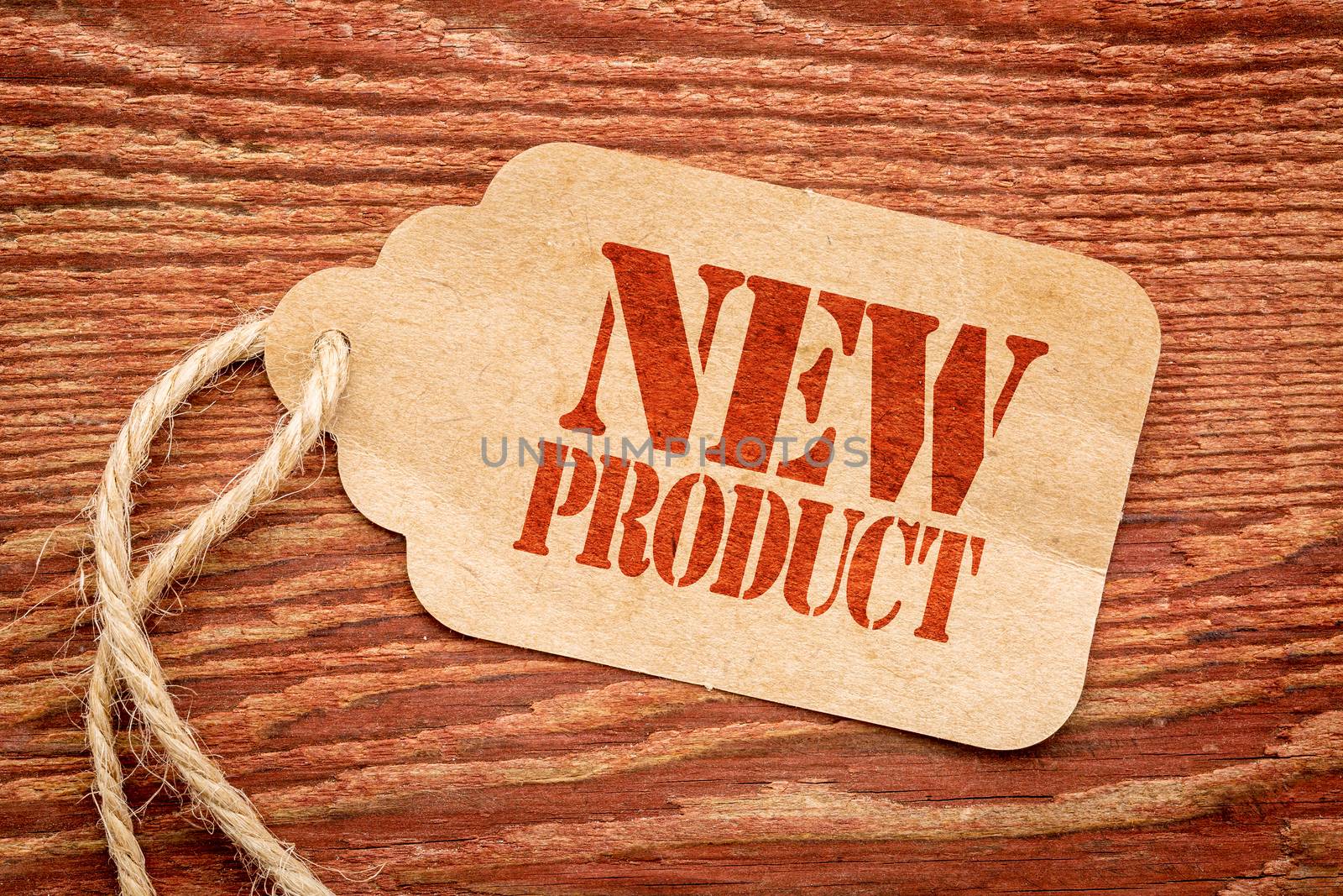 new product sign  on a price tag by PixelsAway
