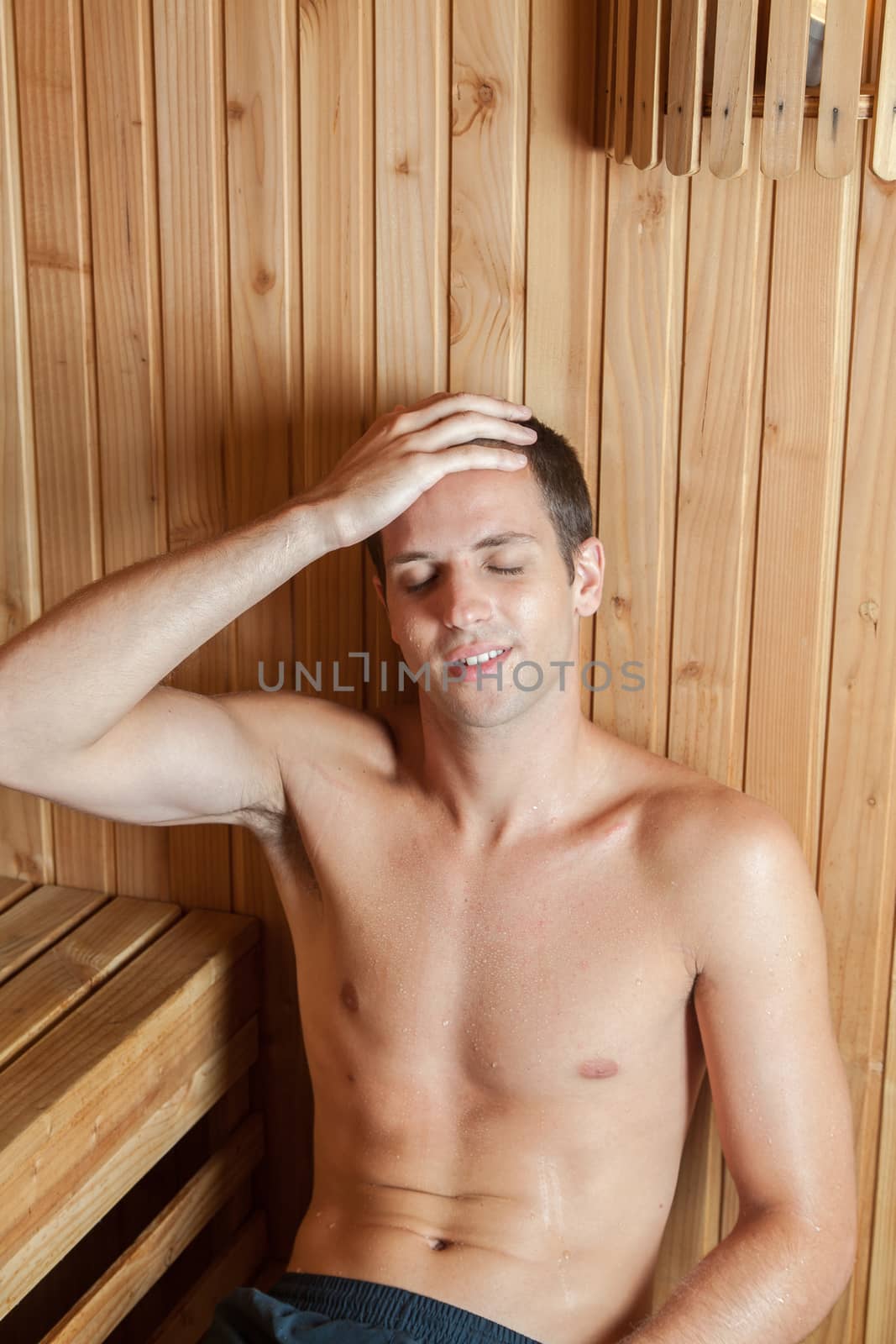 Guy relaxed inside the sauna by ifilms