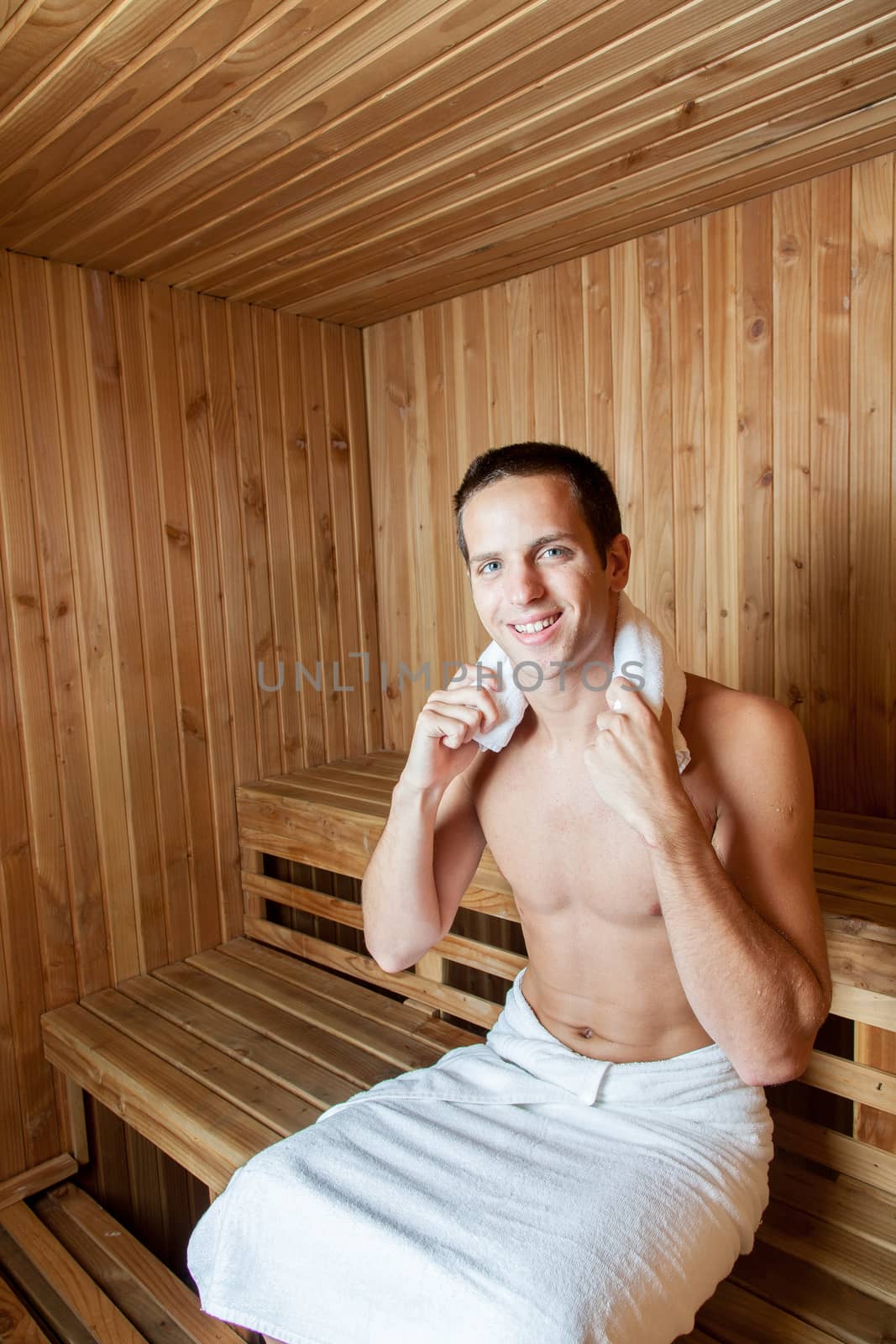 Happy man inside the sauna