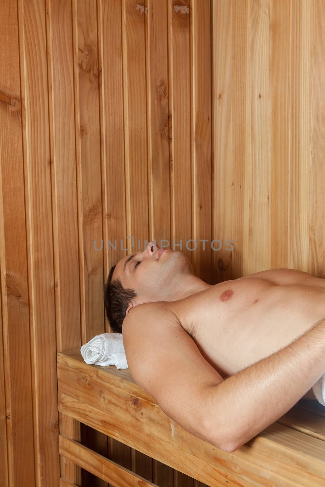 Guy laid inside the sauna