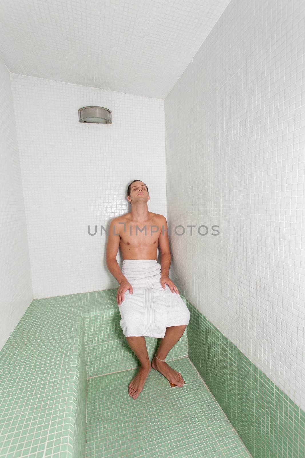 Man relaxed inside the sauna by ifilms