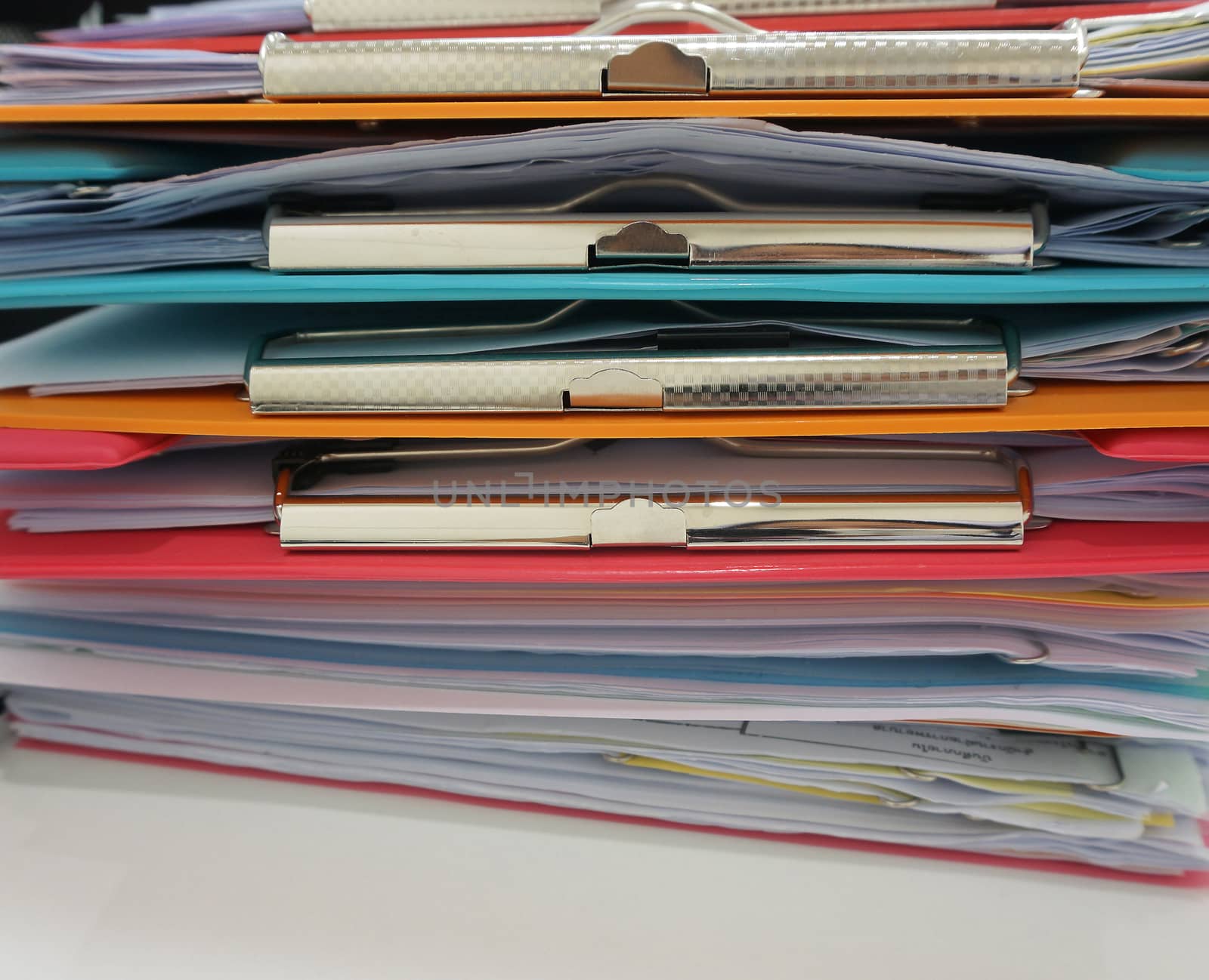 Stack of many color clipboard with documen by ninun