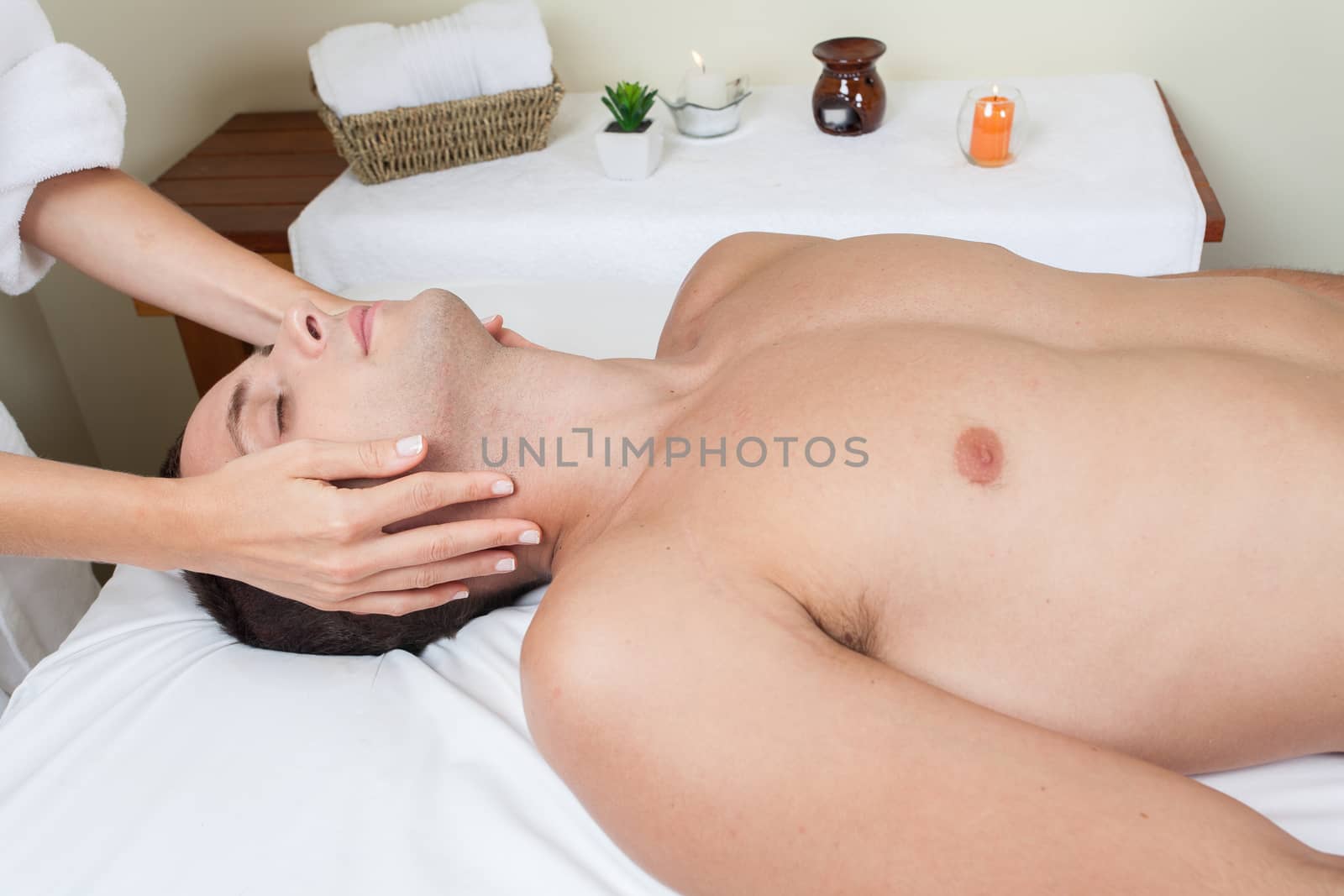 Man laid receiving massage