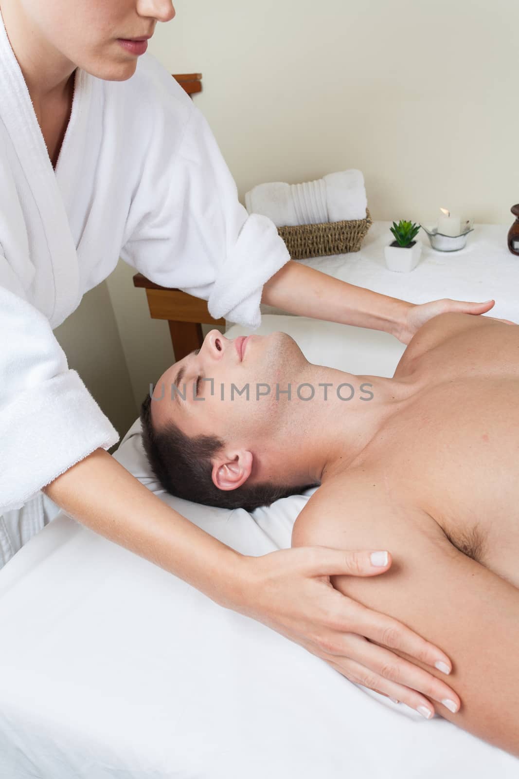 Guy laid receiving massage