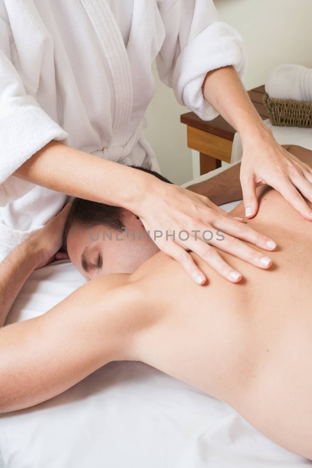 Man back laid receiving massage by ifilms