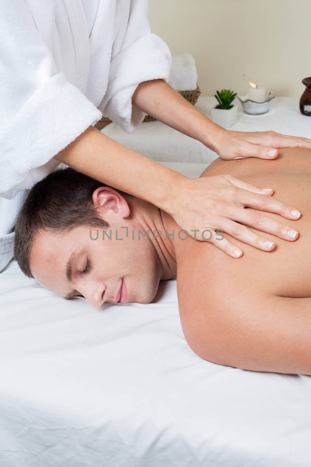 Smiling man gets a massage by ifilms