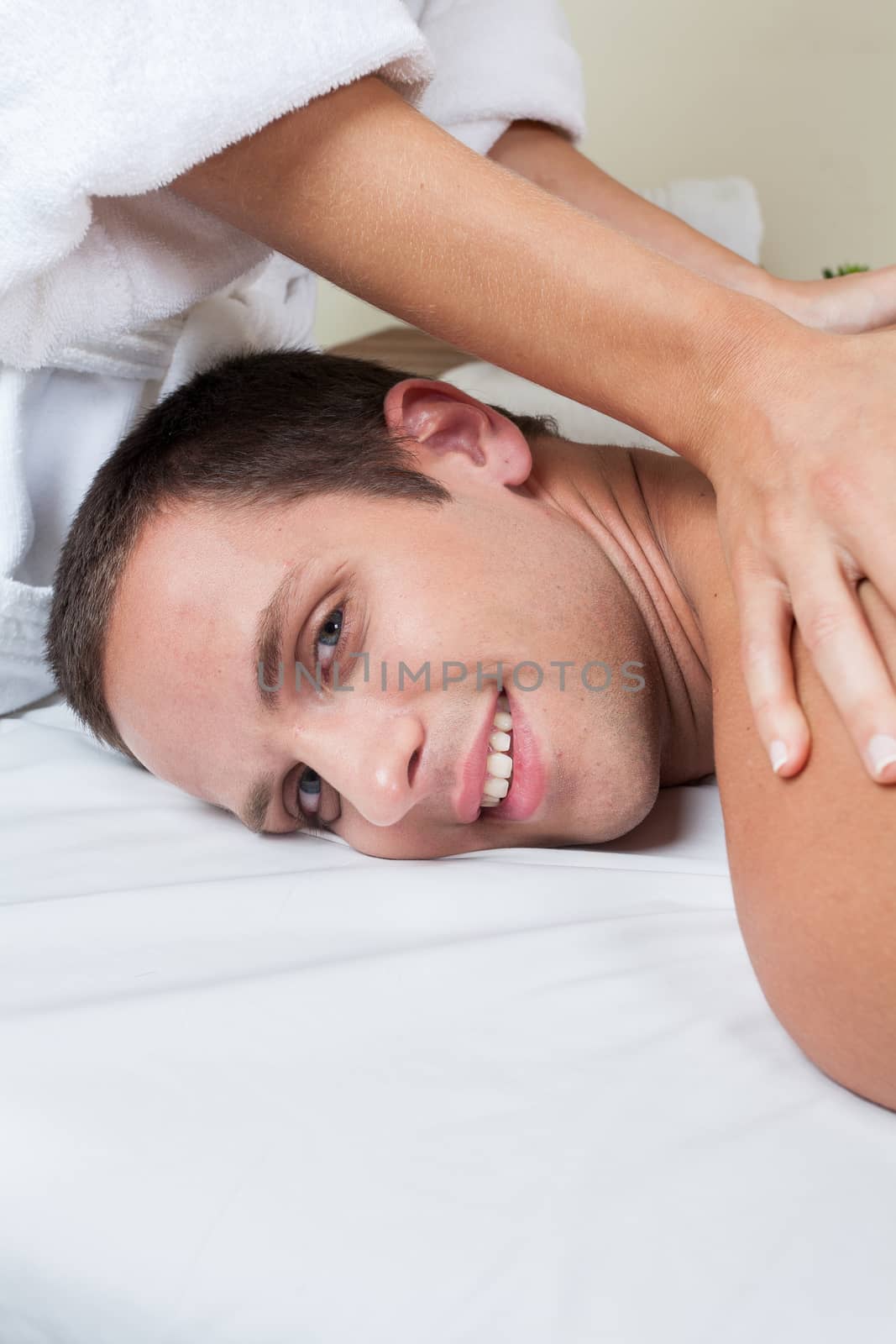 Happy man receiving a massage