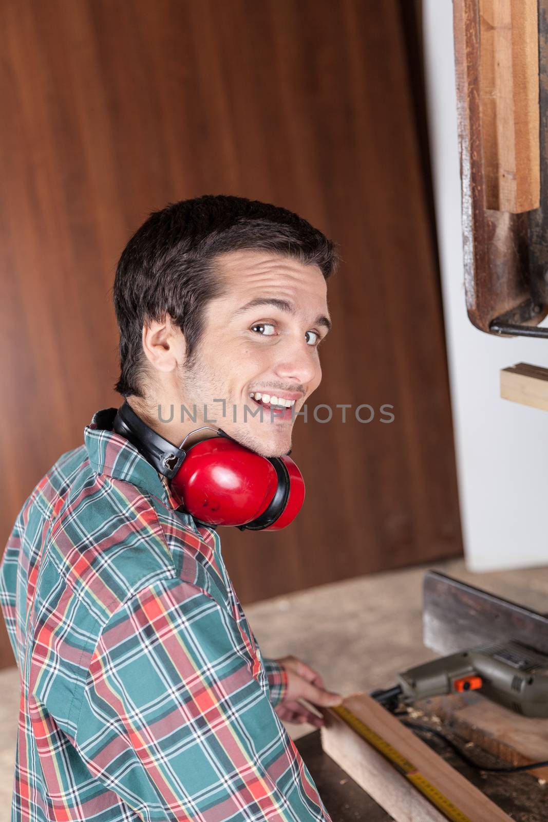 Happy guy working with wood