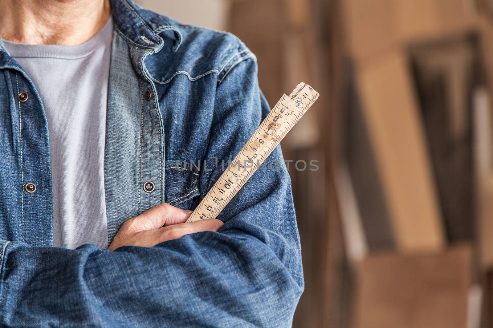 Carpenter holding a ruler