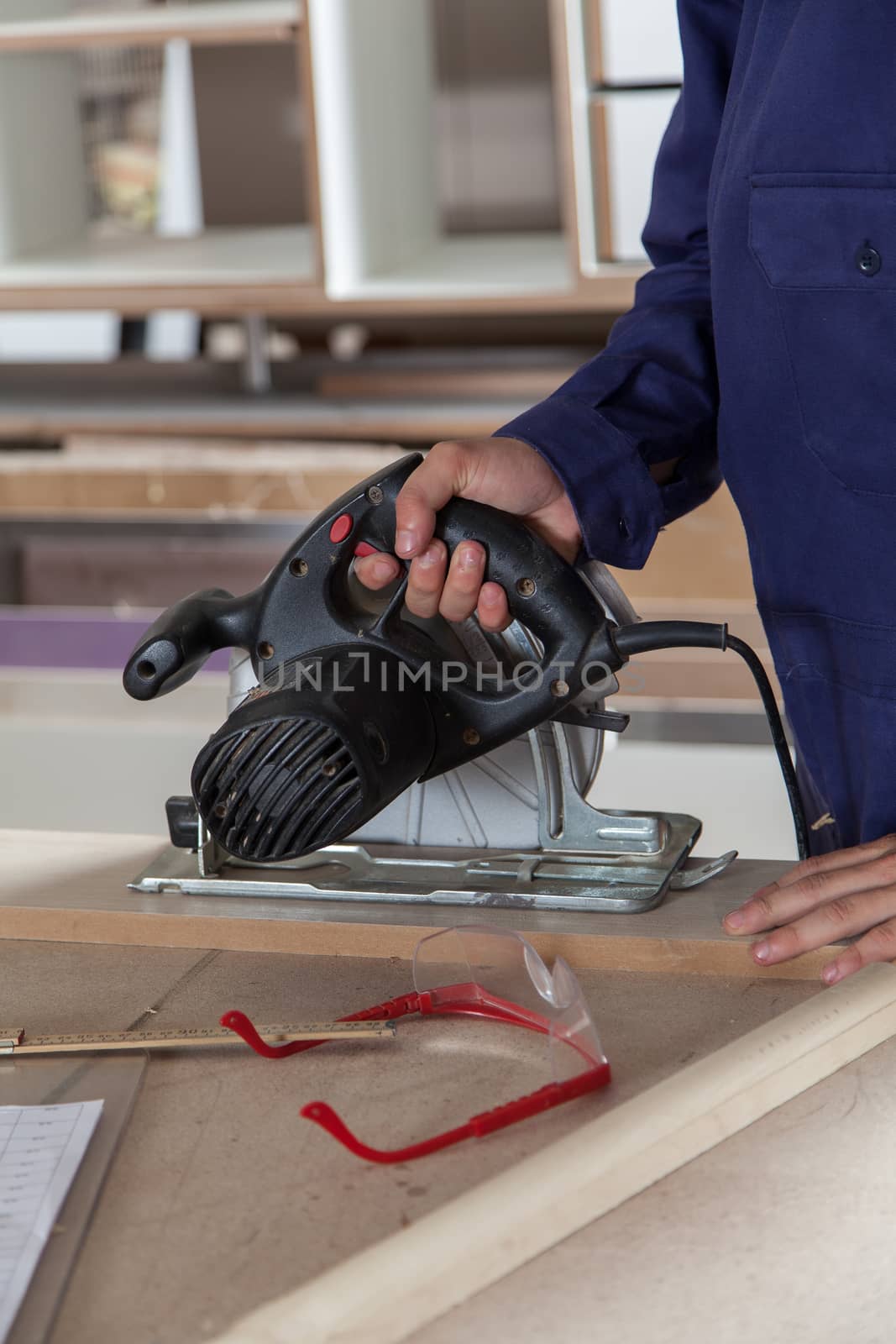 Man hoding a electric saw by ifilms