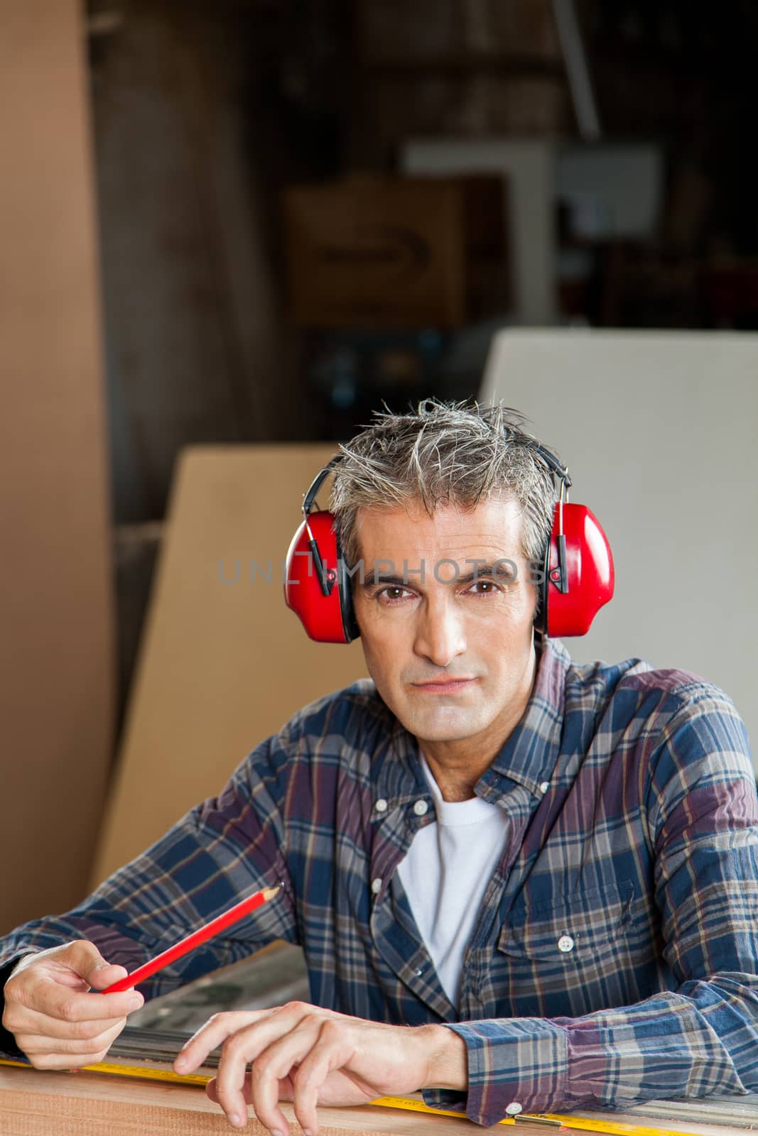 Serious carpenter with headphones by ifilms