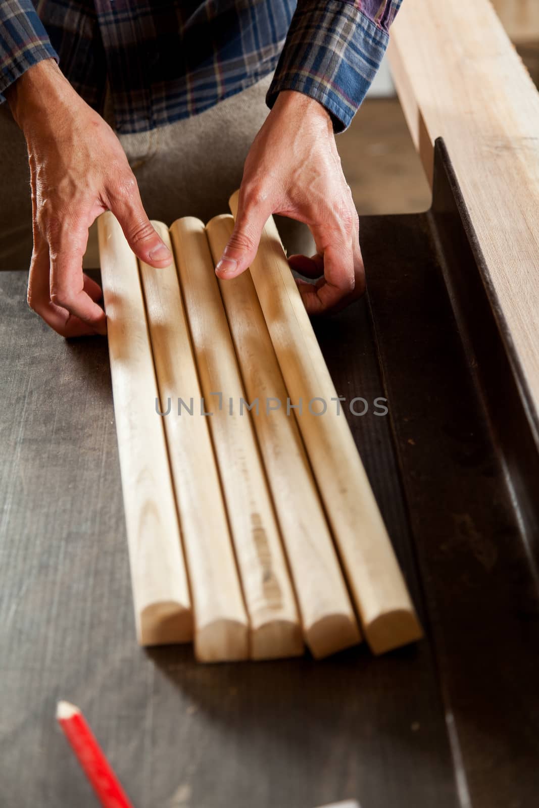 Man taking a pieces of wood