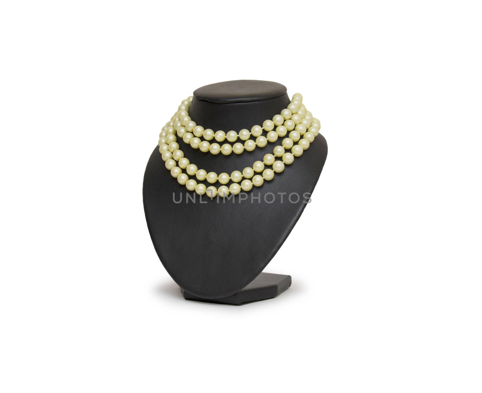 Pearl necklace on black mannequin isolated by cocoo