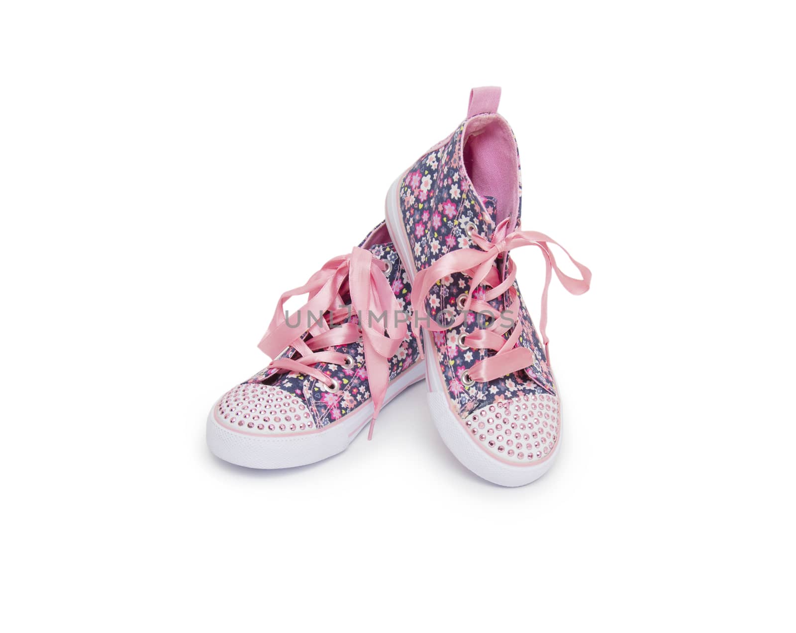 Pair of pink sport shoes on white background by cocoo