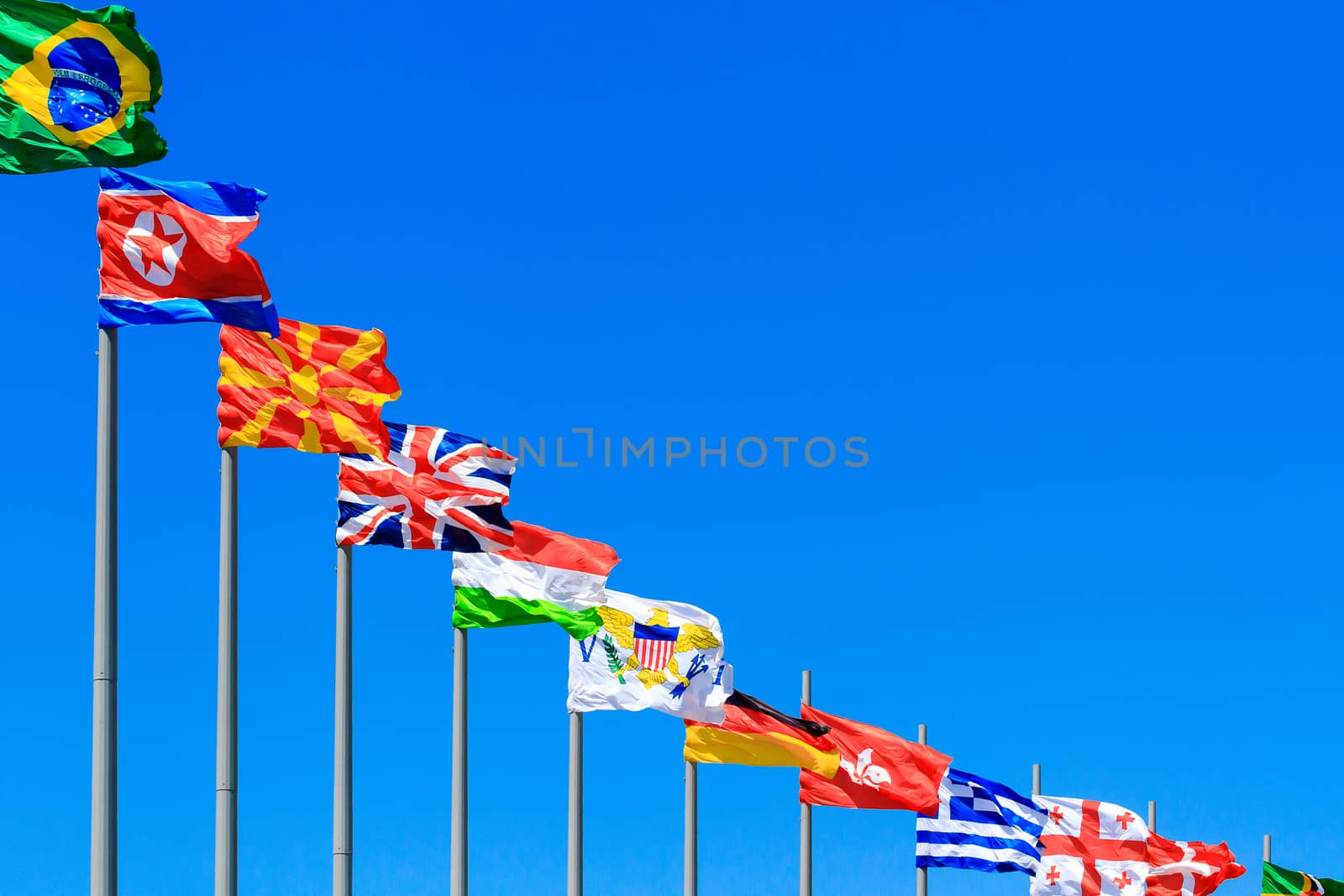 Flags against blue sky, copyspace