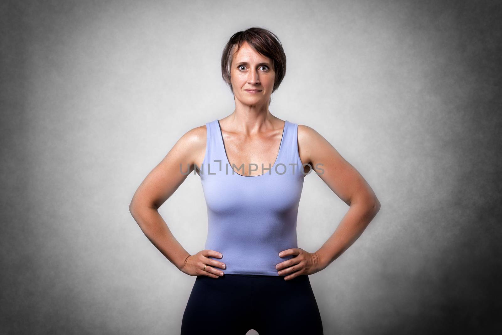 Image of middle aged confident woman in sportswear