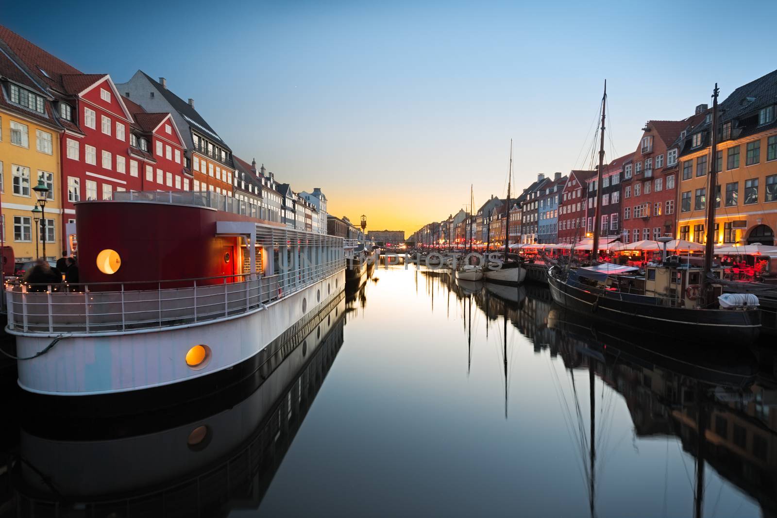 Ships in Nyhavn at sunset, Copenhagen, Denmark by fisfra