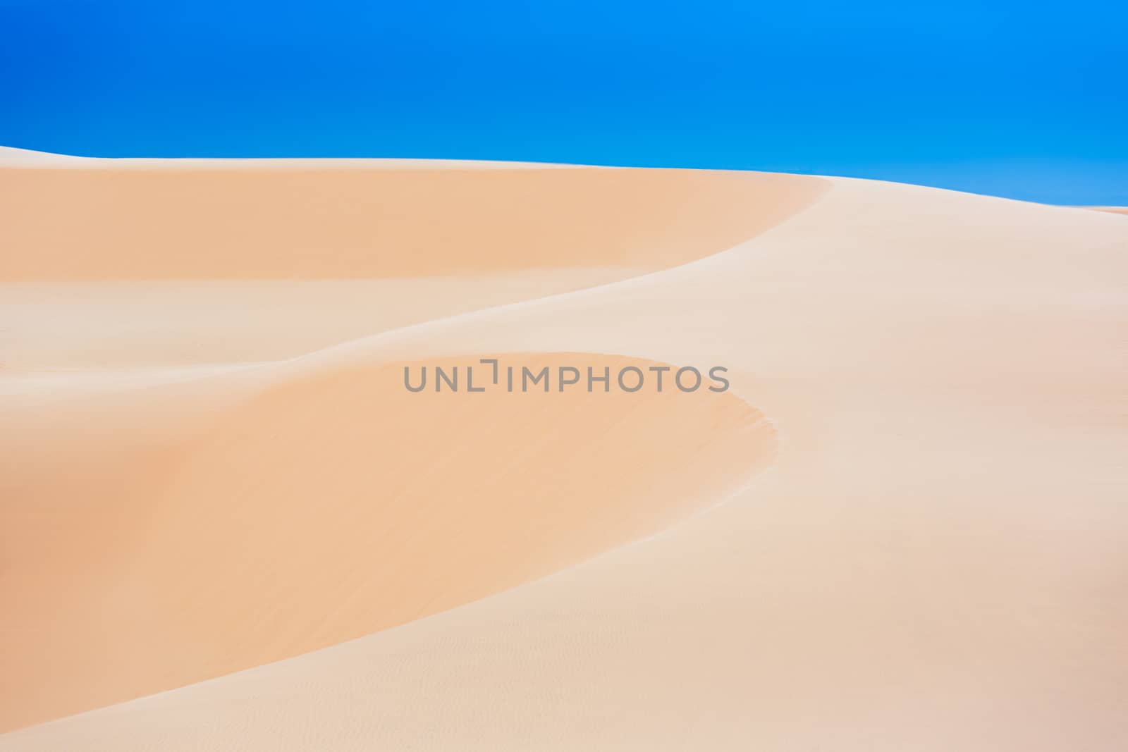 White sand dunes with blue skies, Mui Ne, Vietnam