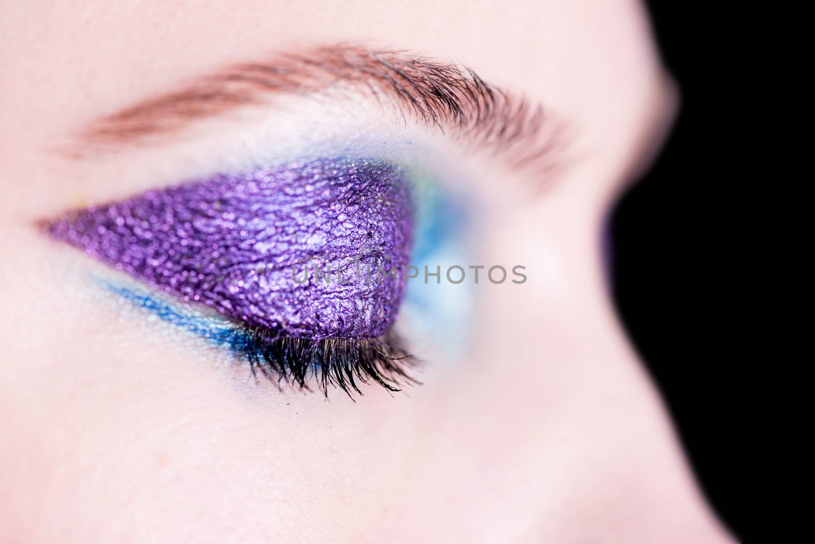 Female eye with fashion bright eye-shadow by stockyimages