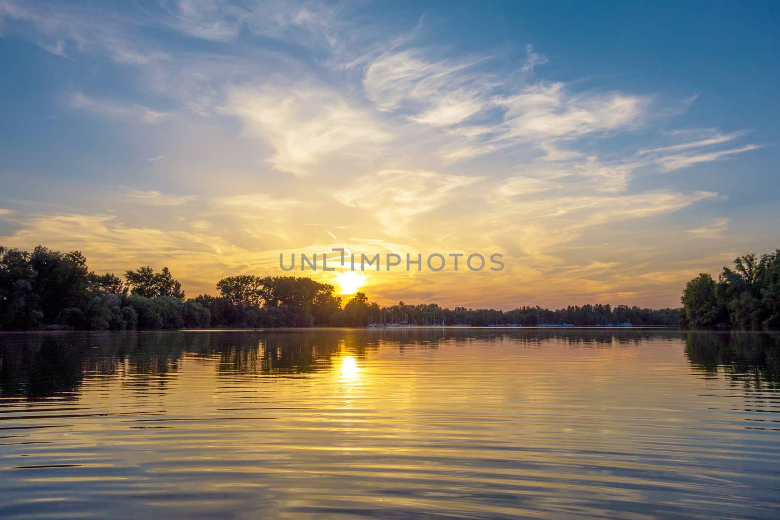 Sunrise / sunset at a lake by aldorado