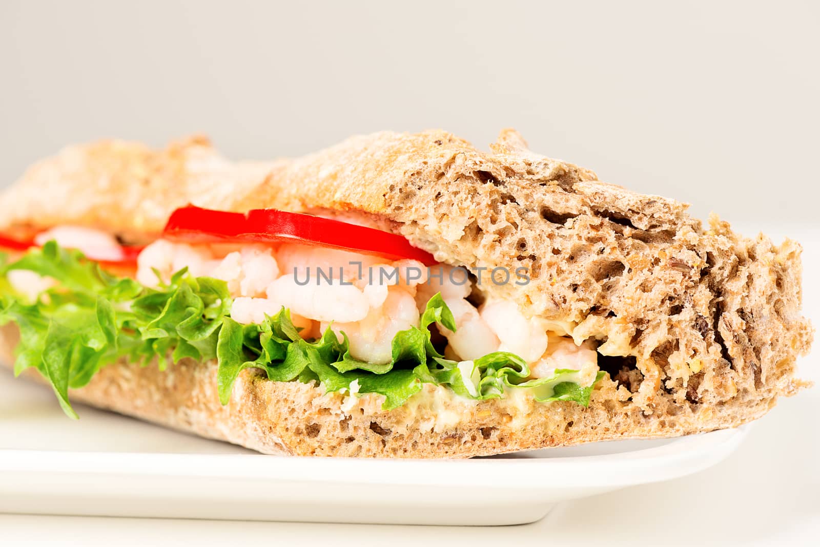 Prawn sandwich on white plate by Nanisimova