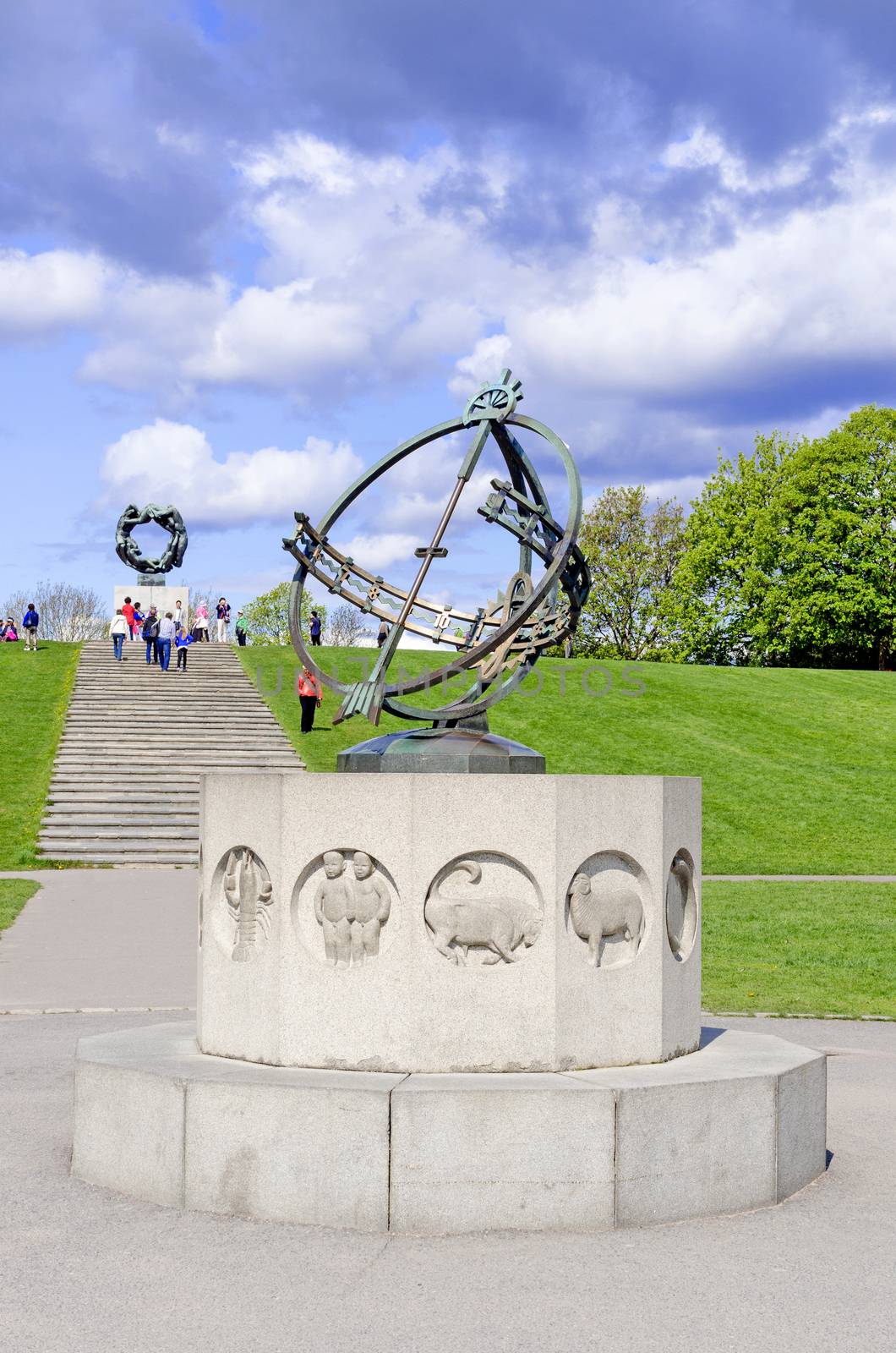 Statues in Vigeland park in Oslo sundial vertical by Nanisimova