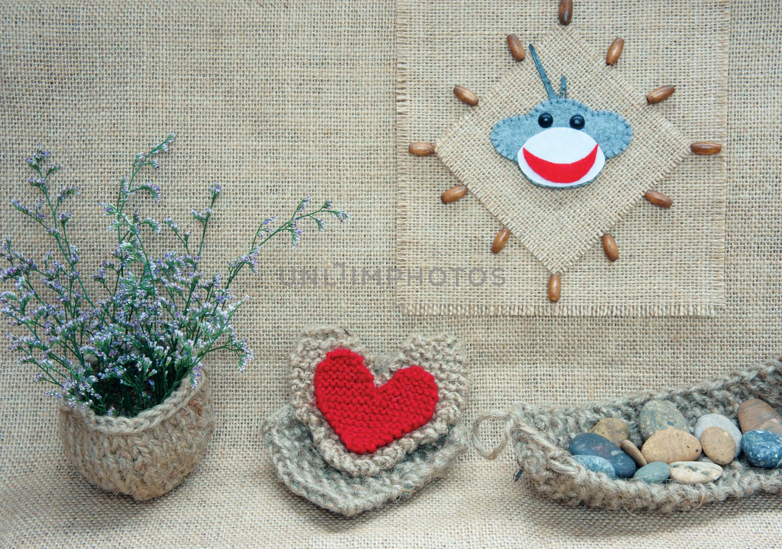 Art idea with funny monkey for happy new year 2016, new year eve time, handmade monkey face, clockwise on hand made clock, heart, flower decor on burlap background, vintage concept