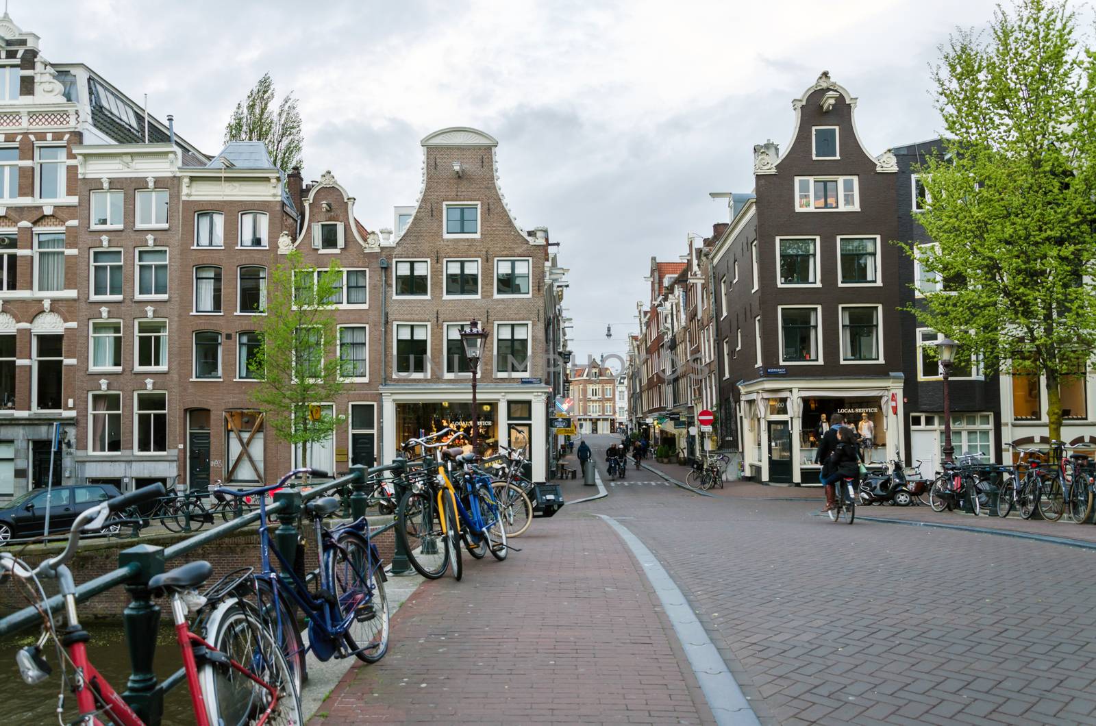 Amsterdam, Netherlands - May 7, 2015: Dutch People in the city of Amsterdam by siraanamwong