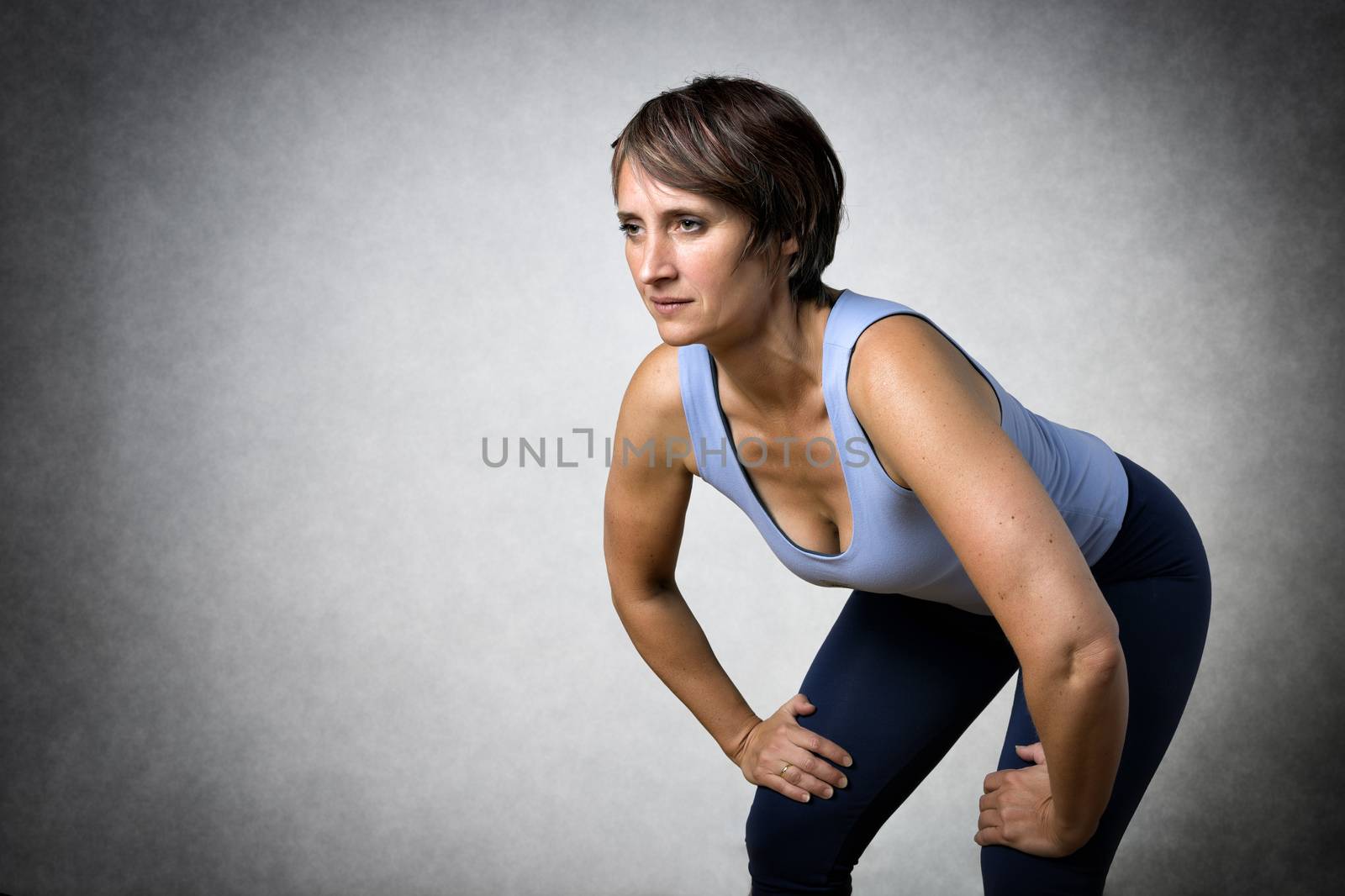 Image of middle aged handsome woman in sportswear