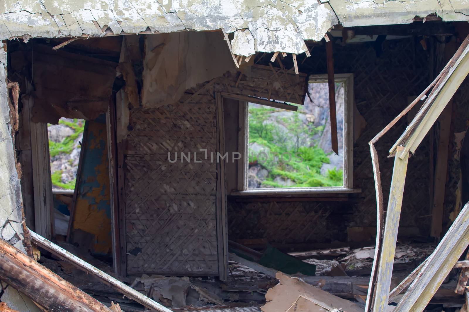 ruins of the house. In the empty window visible fragments wildlife.