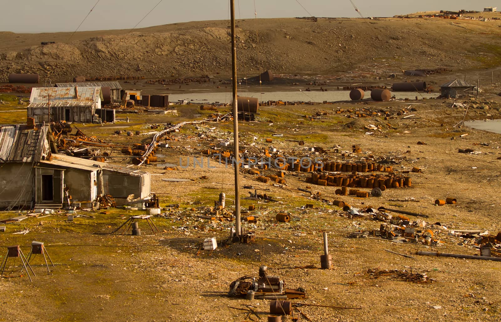 ollapsing polar station in the North island, the island of Novaya Zemlya. A large number of abandoned barrels of fuel