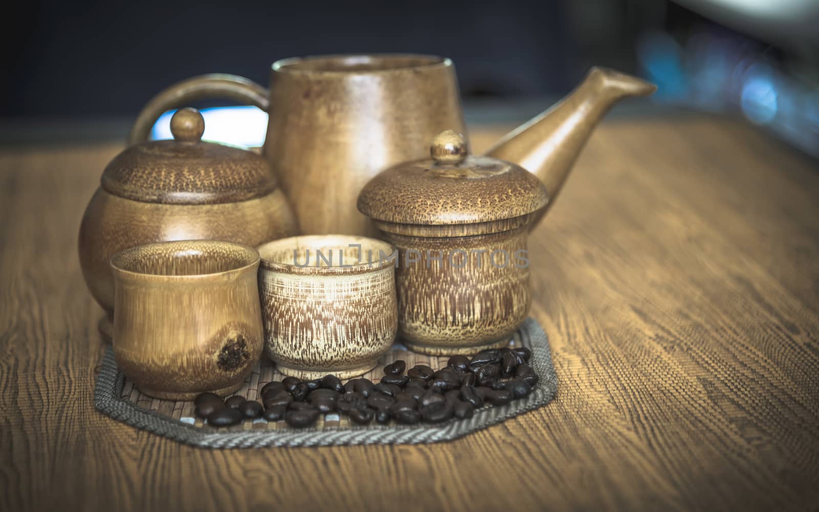 Vintage photo of coffee beans and Coffee cups set on wooden background.Vintage style.