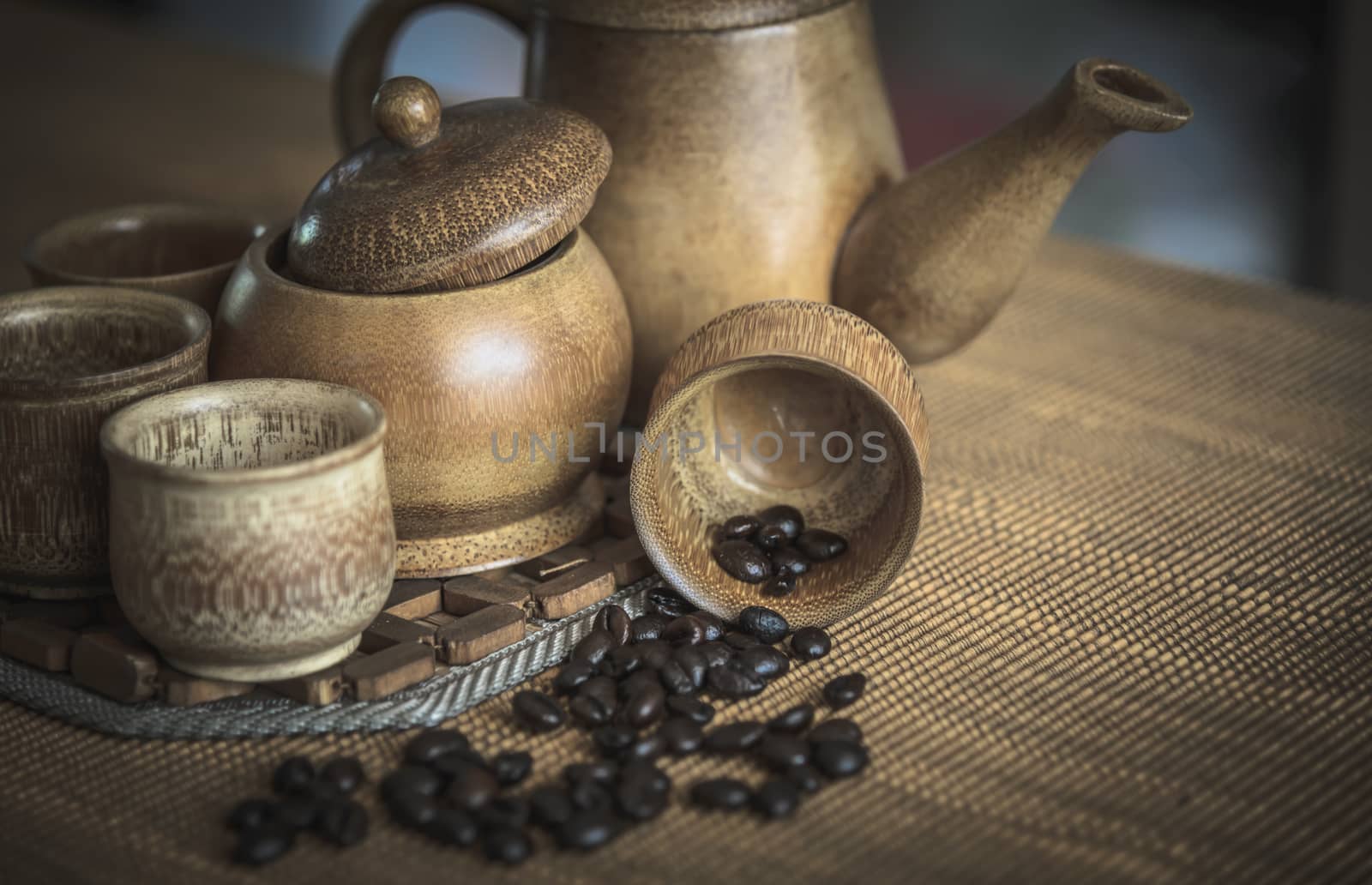 Vintage photo of coffee beans and Coffee cups set on wooden background.Vintage style.