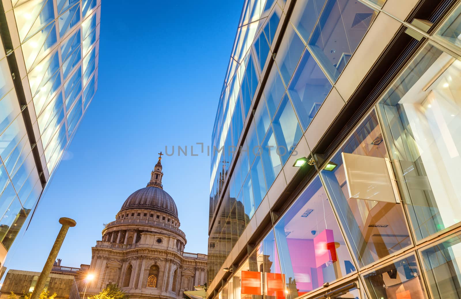 Wonderful glass reflections of St Paul Cathedral dome at night, London.