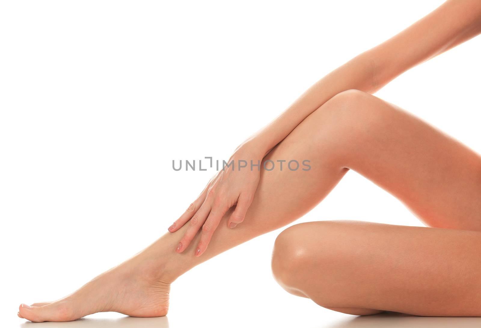 Female legs and hands, white background, isolated