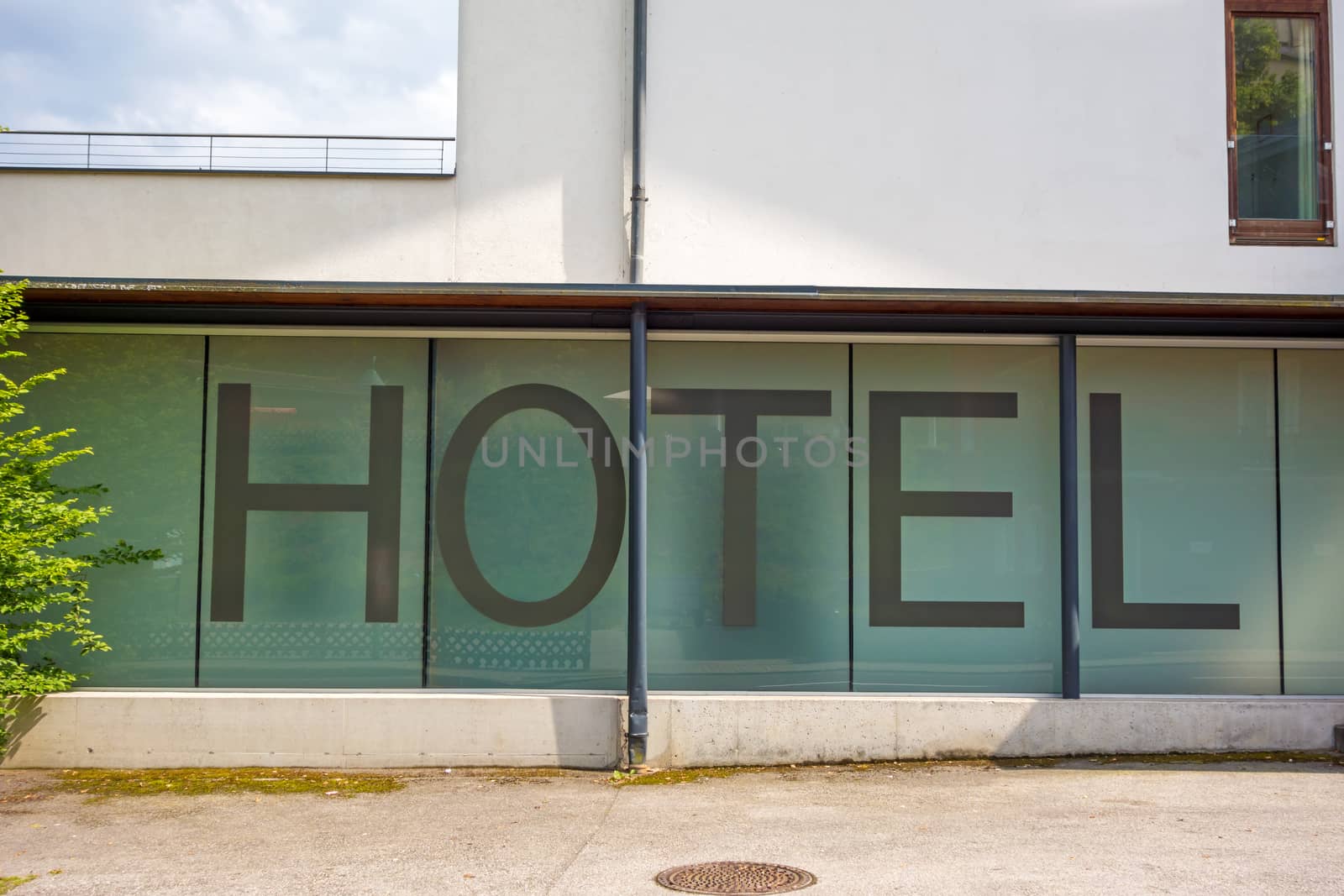 Hotel written on a window with uppercase letters