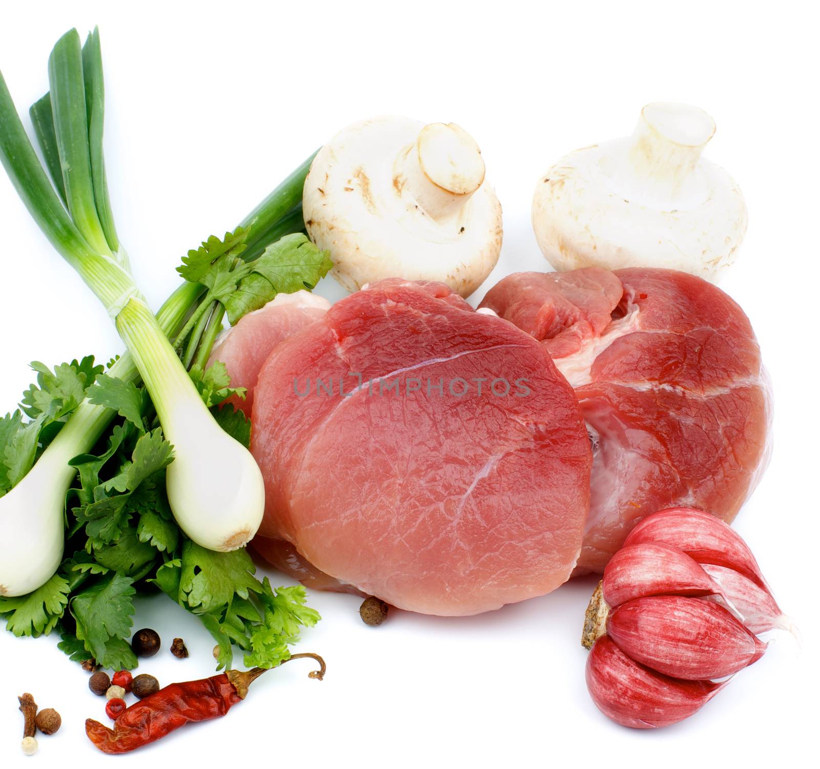 Arrangement of Perfect Piece of Boneless Raw Pork with Parsley, Spring Onion, Spices and Edible Mushrooms isolated on white background